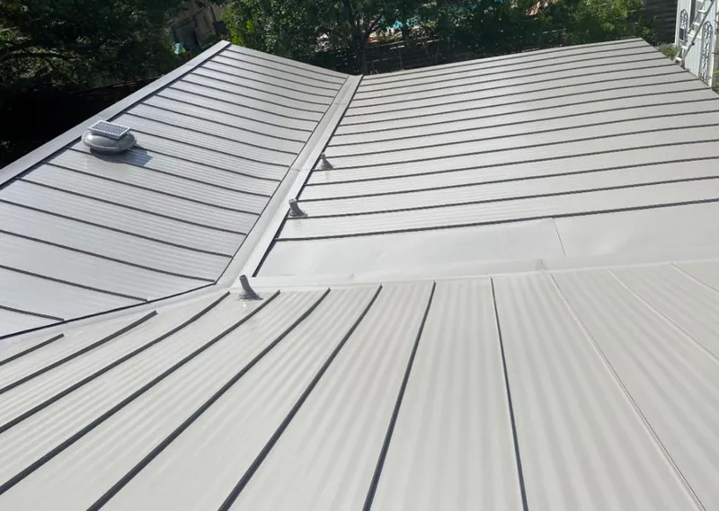 Solar attic fan installed on a metal roof for Roof Ventilation in Santa Cruz